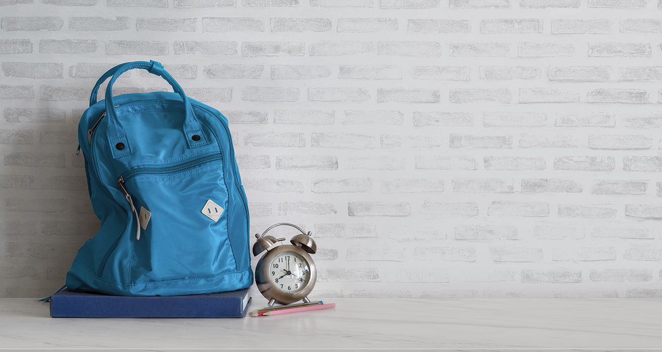 A backpack and alarm clock.
