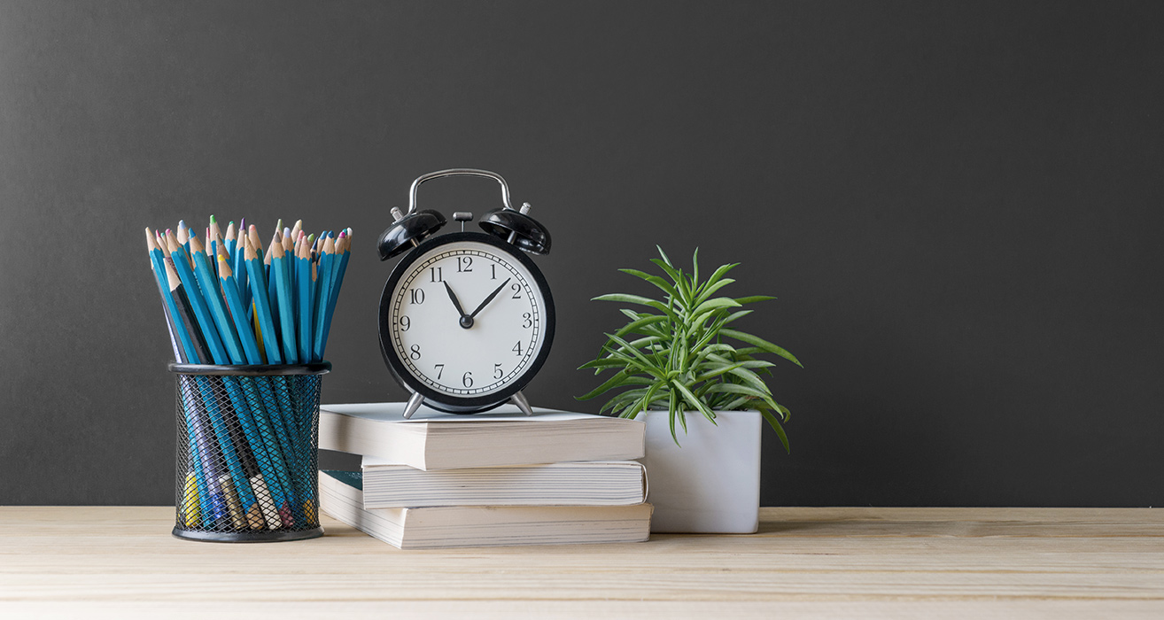 School supplies sitting on a desk.